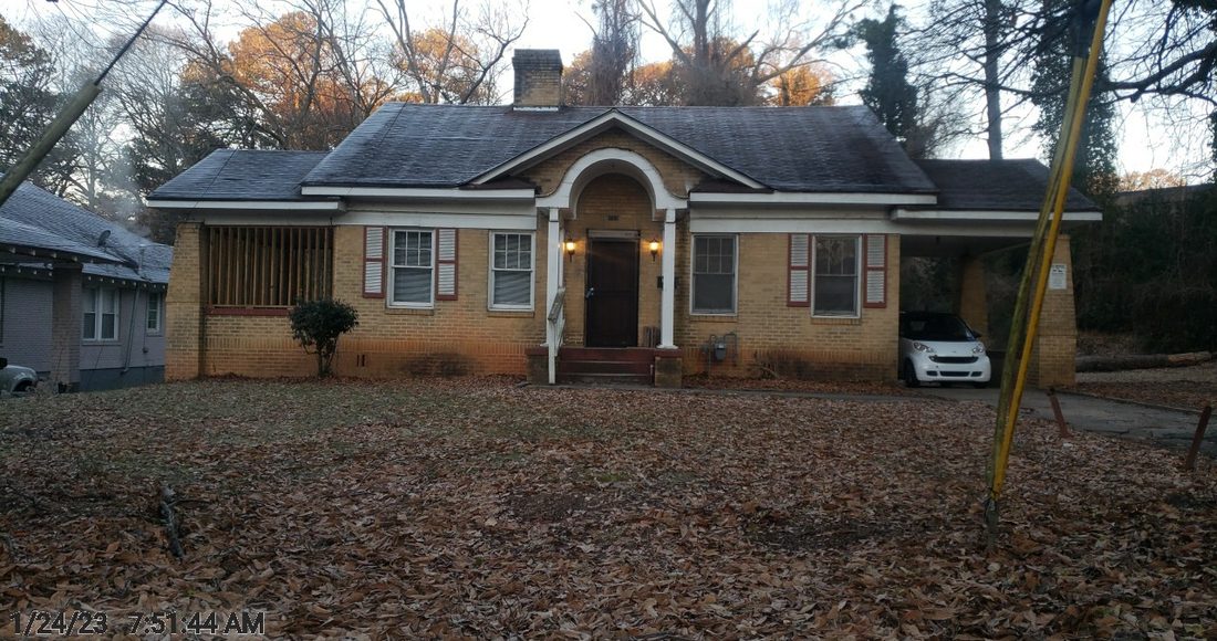 Front exterior of the original 1920s brick bungalow, unrenovated